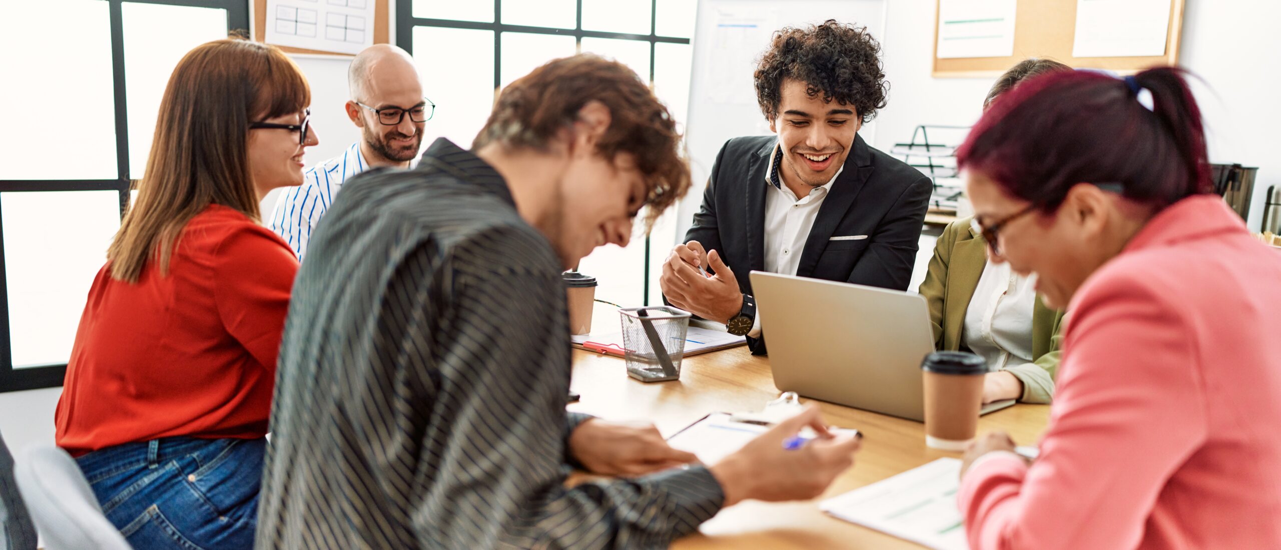 Group of business workers smiling happy working at the office.